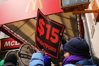 caption: Protesters with NYC Fight for $15 gather in front of a McDonalds to rally against fast food executive Andrew Puzder, who was President Trump's nominee to lead the Labor Department on February 13, 2017 in New York City.