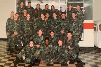 caption: Jessica Israelsen (first from the left in the second row from bottom) in 2003, when she first joined the U.S. Air Force as a medical technician. In 2008, when she was struggling financially, her unit purchased Christmas gifts for her family.
