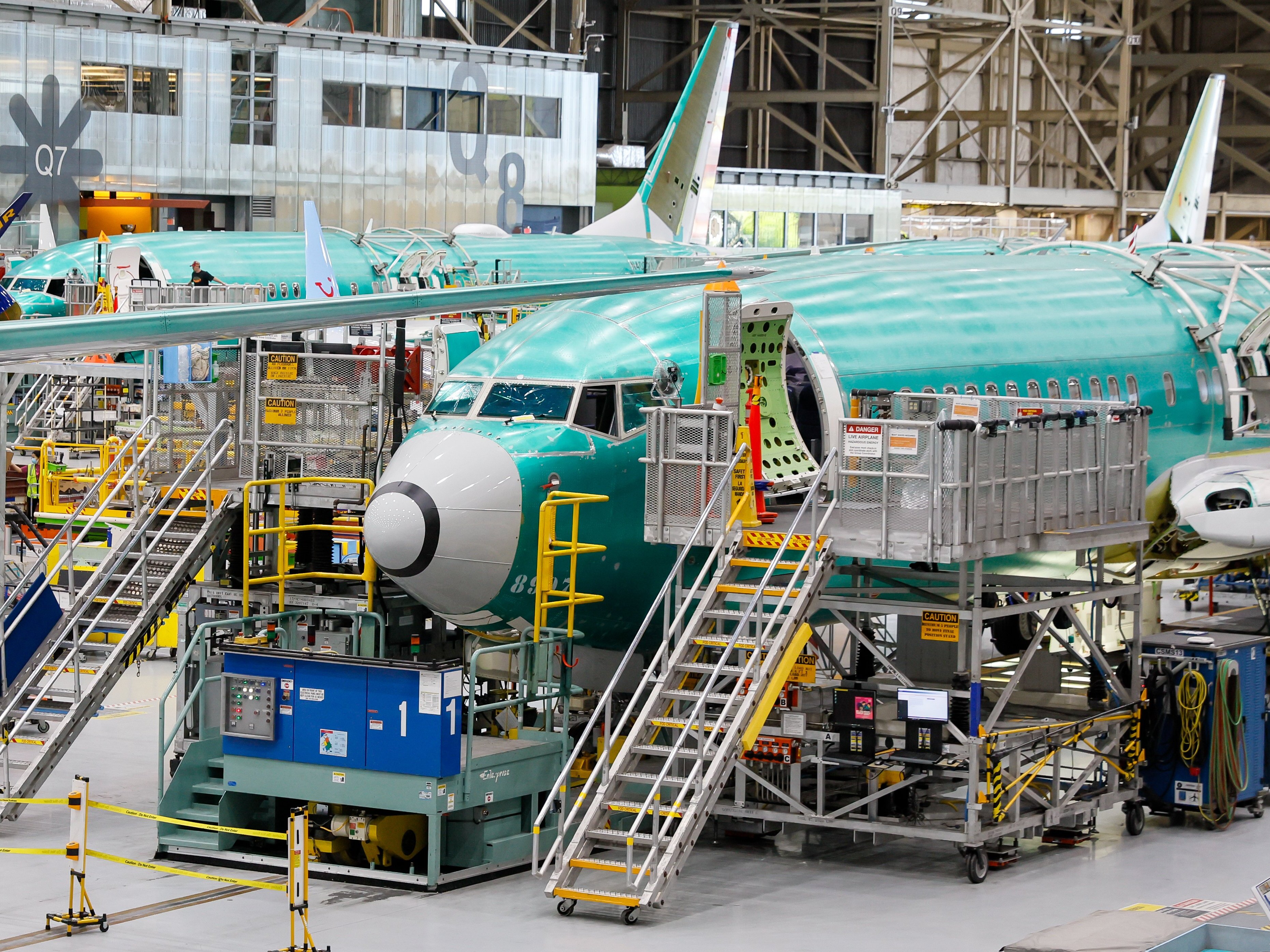 caption: Boeing is changing how it trains new recruits at the factory near Seattle where it assembles the 737 Max, part of a broader effort to improve quality after a midair blowout. 737 Max aircraft are seen in various states of assembly at the Boeing factory in Renton, Wash., on Tuesday. 