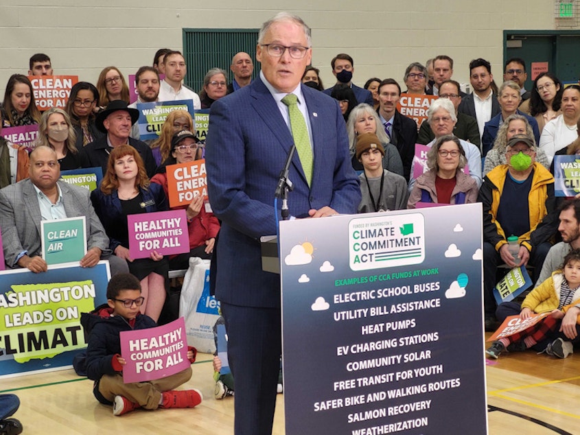 caption: Washington Gov. Jay Inslee announced his 2024 climate agenda in Seattle Monday, Dec. 11, 2023, with a crowd of supporters present to show their support for the state's Climate Commitment Act. 
