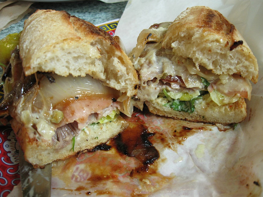 caption: Cuban Press Sandwich from Paseo. Messy, but delicious. 