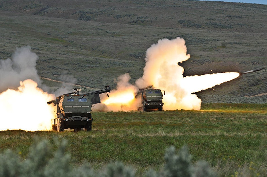 caption: Soldiers fire two rounds from their High Mobility Artillery Rocket systems at Yakima Training Center in 2011.