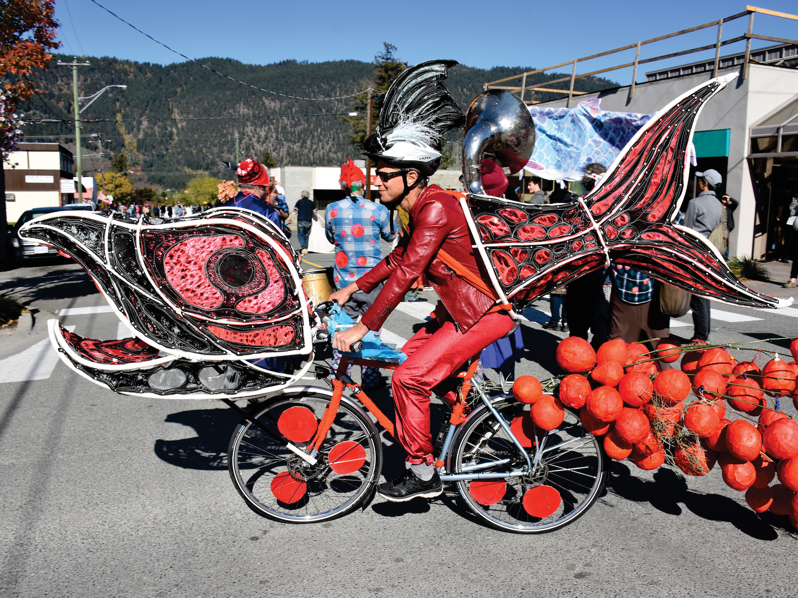 caption: Costumed activists riding elaborately decorated bicycles paraded down the streets of Vancouver last month to bring attention to the challenges facing the sockeye salmon population in the Fraser River and its connection to Canada's indigenous people.