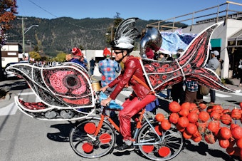 caption: Costumed activists riding elaborately decorated bicycles paraded down the streets of Vancouver last month to bring attention to the challenges facing the sockeye salmon population in the Fraser River and its connection to Canada's indigenous people.