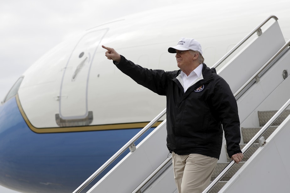 caption: President Donald Trump gestures after arriving at McAllen International Airport for a visit to the southern border, Thursday, Jan. 10, 2019, in McAllen, Texas. (Evan Vucci/AP)