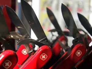 caption: Swiss Army Knives are displayed in a shop in Montreux, Switzerland. Rising violence in parts of the world has prompted governments to crack down on what types of blades people can brandish in public.