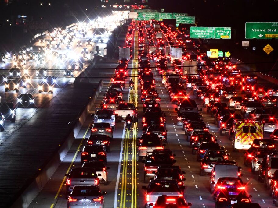 caption: Rush-hour traffic on Interstate 405 in Los Angeles in March 2022. After dropping during the COVID-19 pandemic, congestion levels reached a record high last year, researchers say.