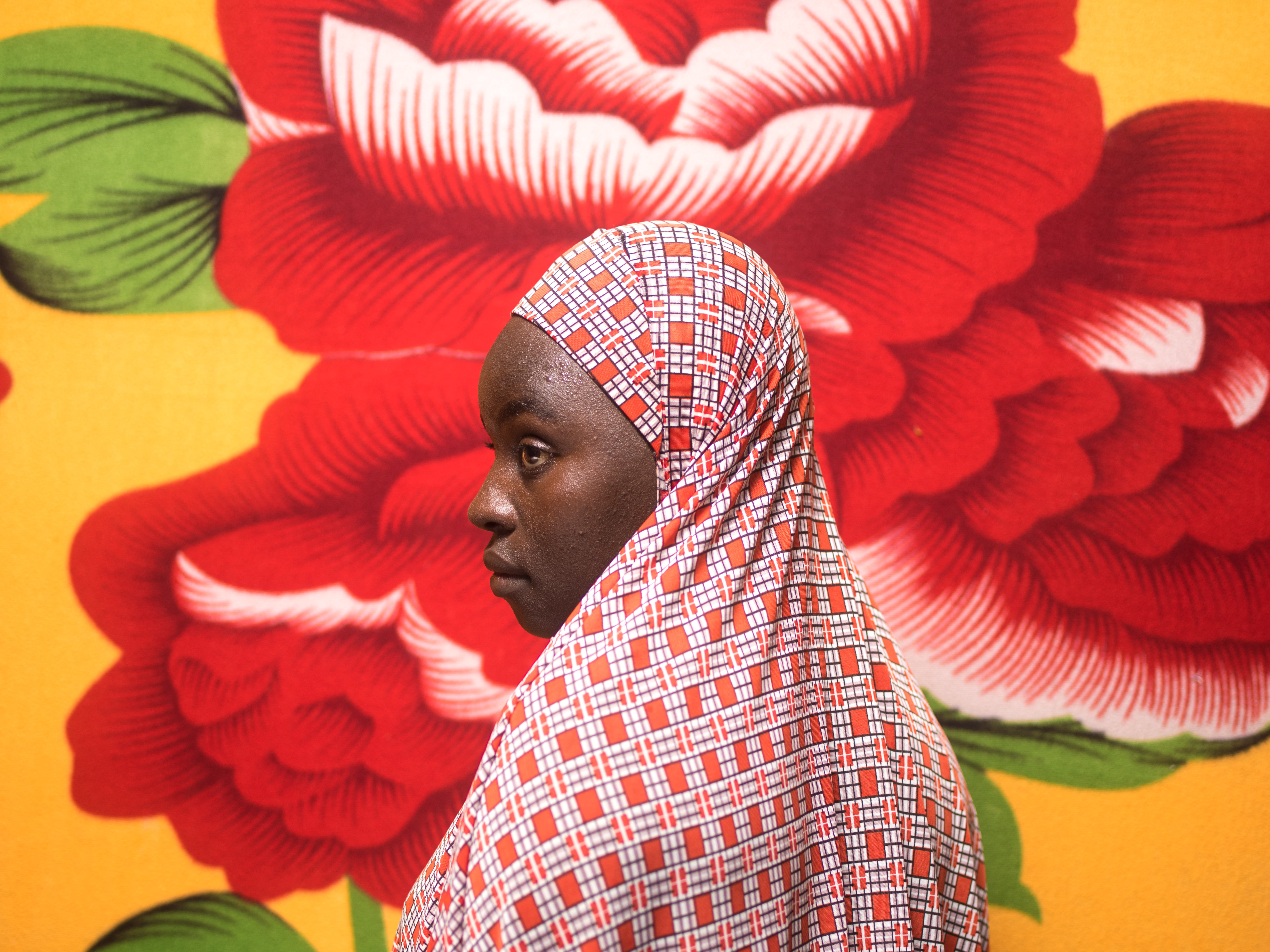 caption: Fatima Dahiru, now 17, lives with her sister and mother in an internally displaced persons camp in Maiduguri, Nigeria. Her village was attacked two years ago.