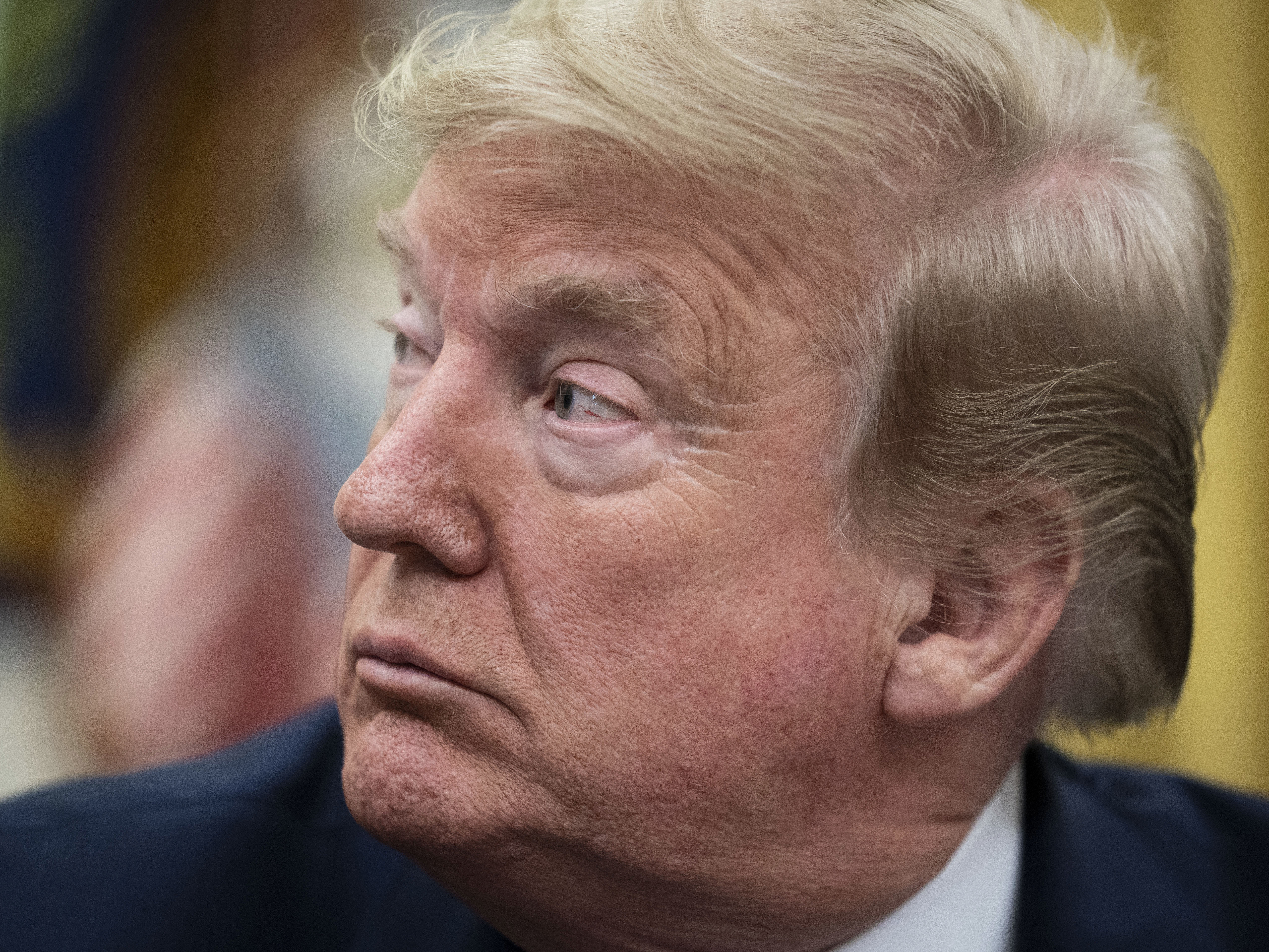 caption: President Trump talks to reporters Wednesday at the White House.
