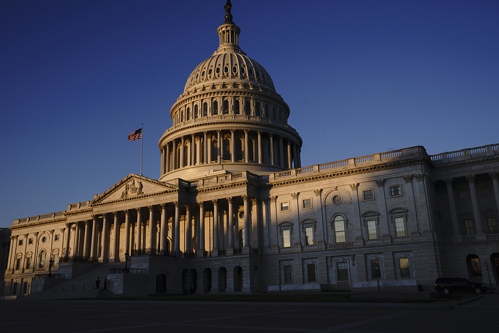 caption: The Capitol is seen at sunrise on the first full day of the impeachment trial of President Trump on charges of abuse of power and obstruction of Congress, in Washington, Tuesday, Jan. 21, 2020. (J. Scott Applewhite/AP)