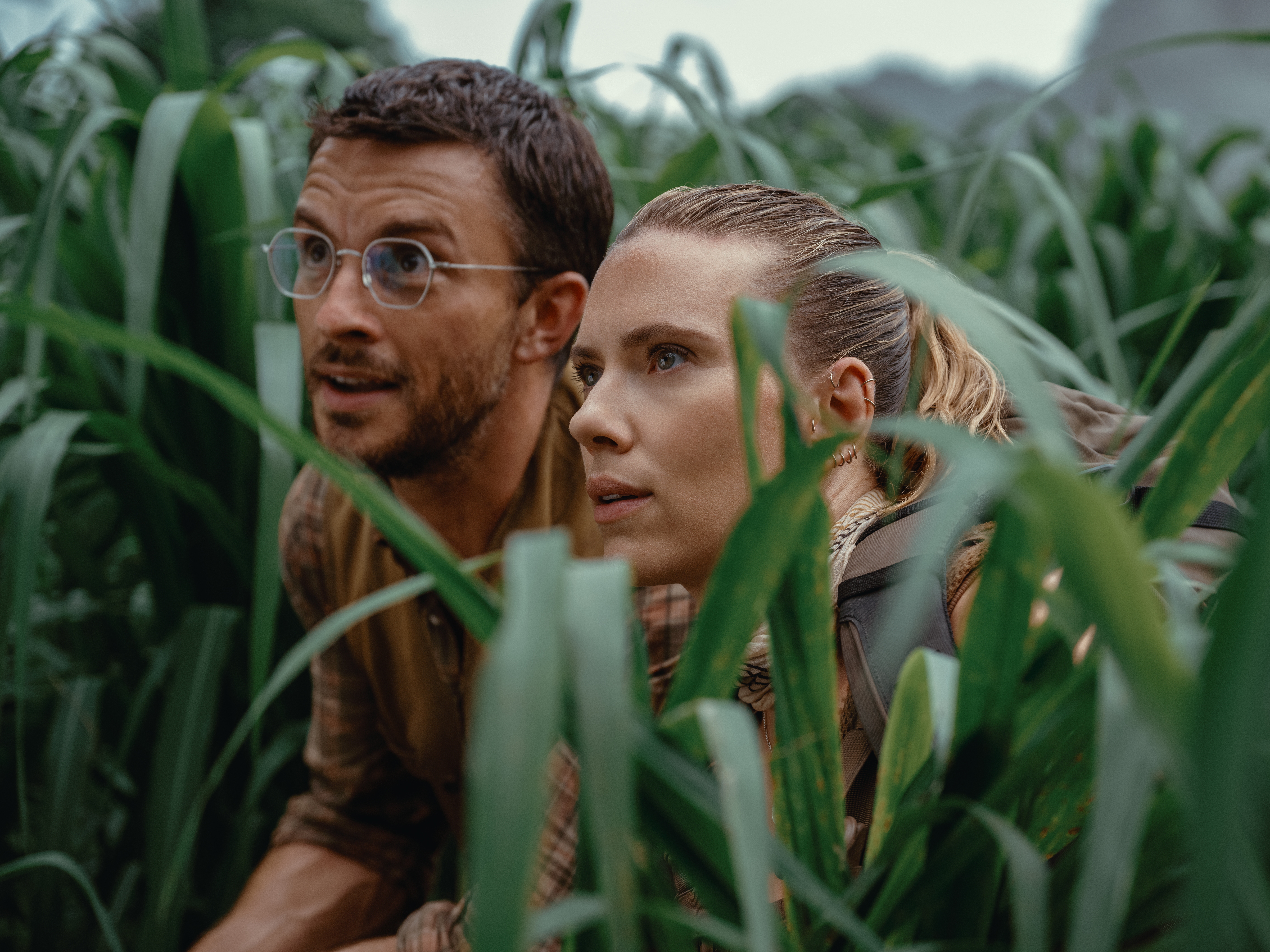 caption: Jonathan Bailey and Scarlett Johansson in<em> Jurassic World Rebirth</em>.
