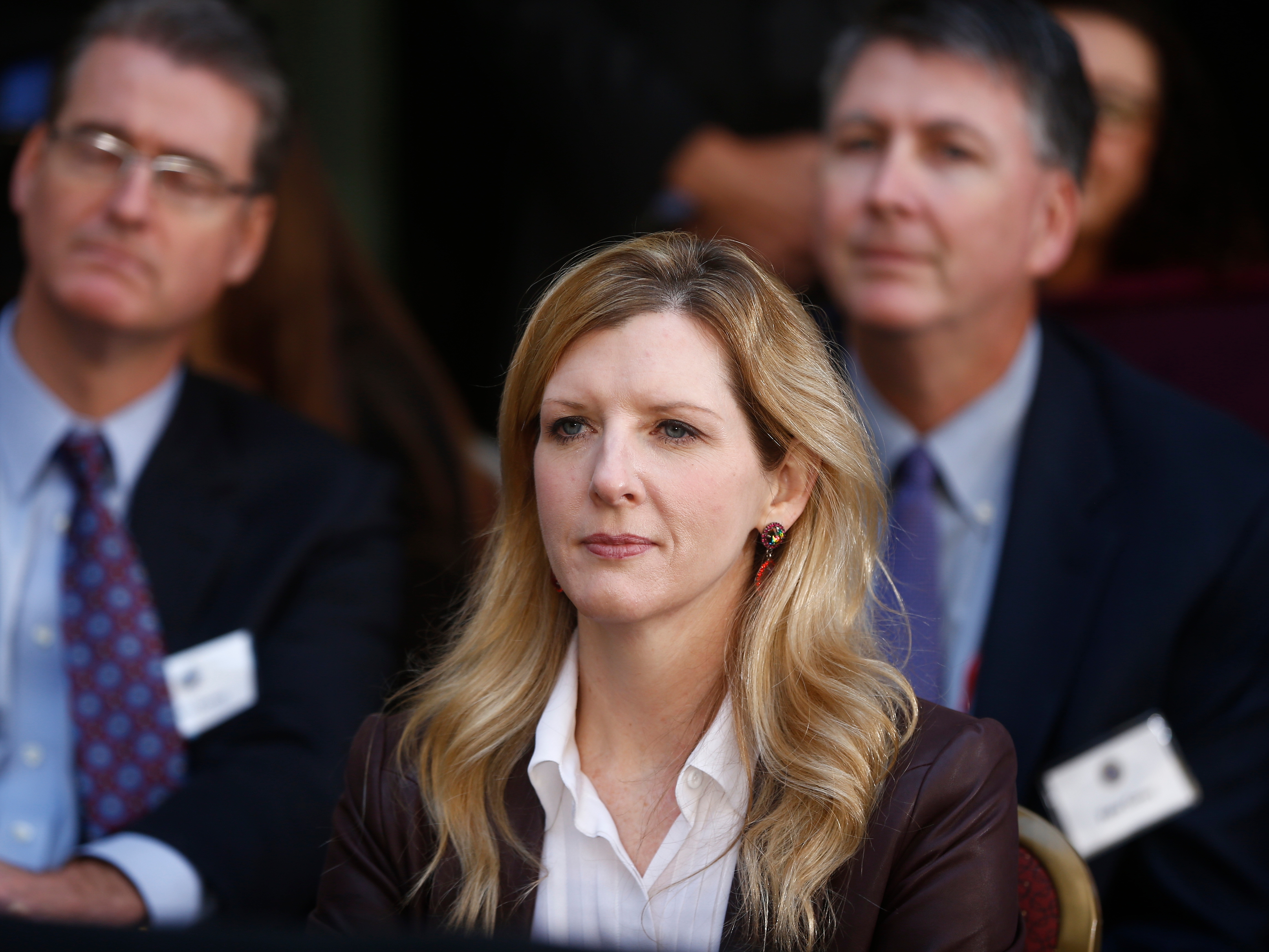 caption: FILE - White House counsel Kathryn Ruemmler listens as President Barack Obama speaks at an installation ceremony for FBI Director James Comey at FBI Headquarters, in Washington, Oct. 28, 2013.