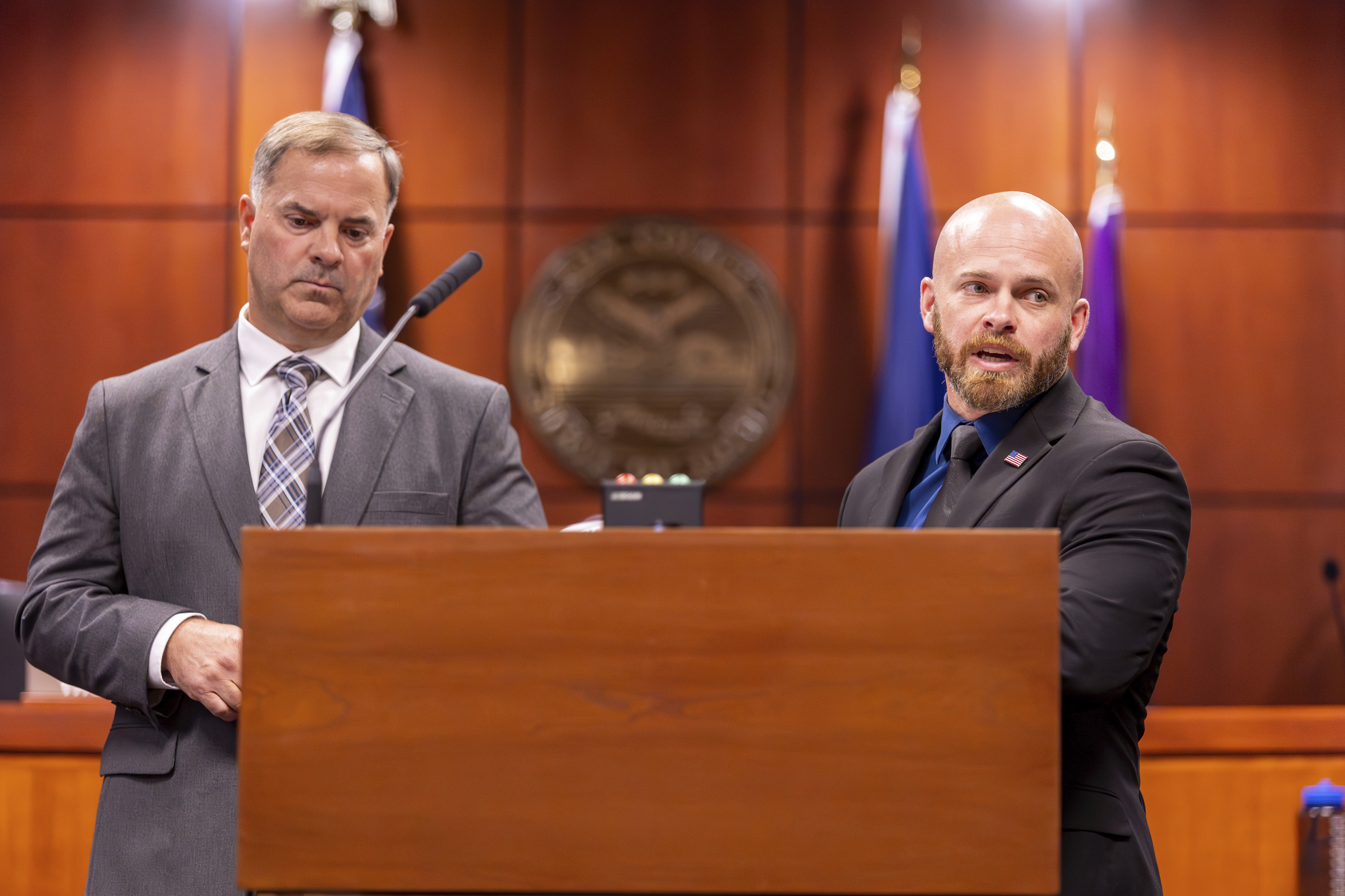 caption: Cpl. Brett Payne of the Moscow Police Department, left, and Lt. Darren Gilbertson of the Idaho State Police, right, speak to the media during a press conference at the Ada County Courthouse after the sentencing of Bryan Kohberger, Wednesday, July 23, 2025. 