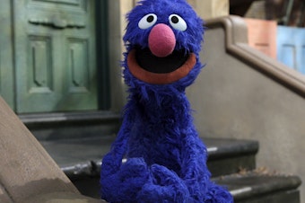 caption: Grover, pictured on "Sesame Street" in 2011, announced on Monday that one of his many jobs is in journalism. The social media response underscored the precarious state of the industry.