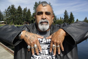 caption: Celestino Rocha, a.k.a. The Fish Killer, has tattoos that say Fear No Fish. He takes fishing in lakes like Angle Lake very seriously and will teach you if you ask.