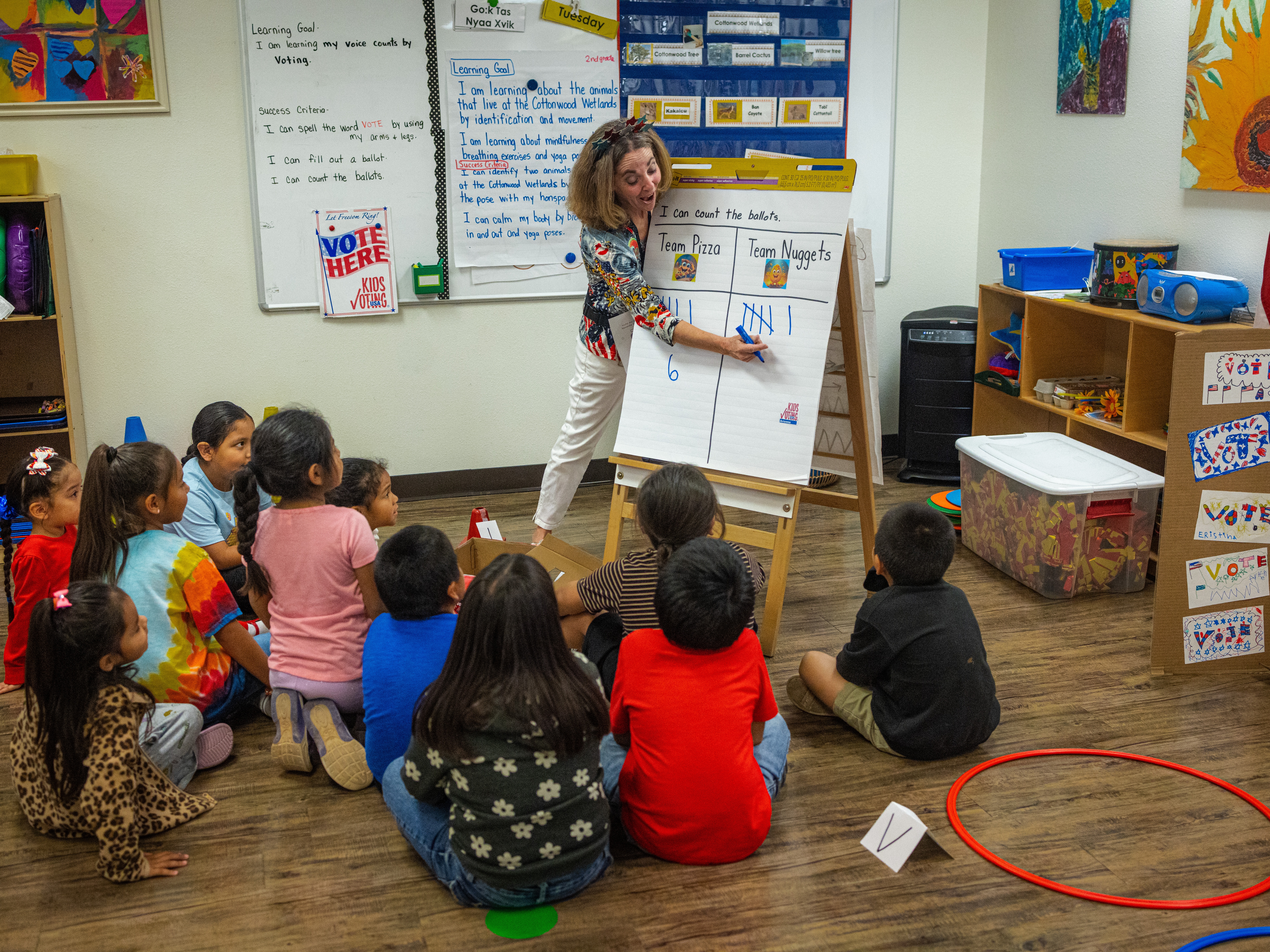 caption: Ms. Meyers and her students begin to count the tallies after counting the ballots at Salt River Elementary School on October 22.