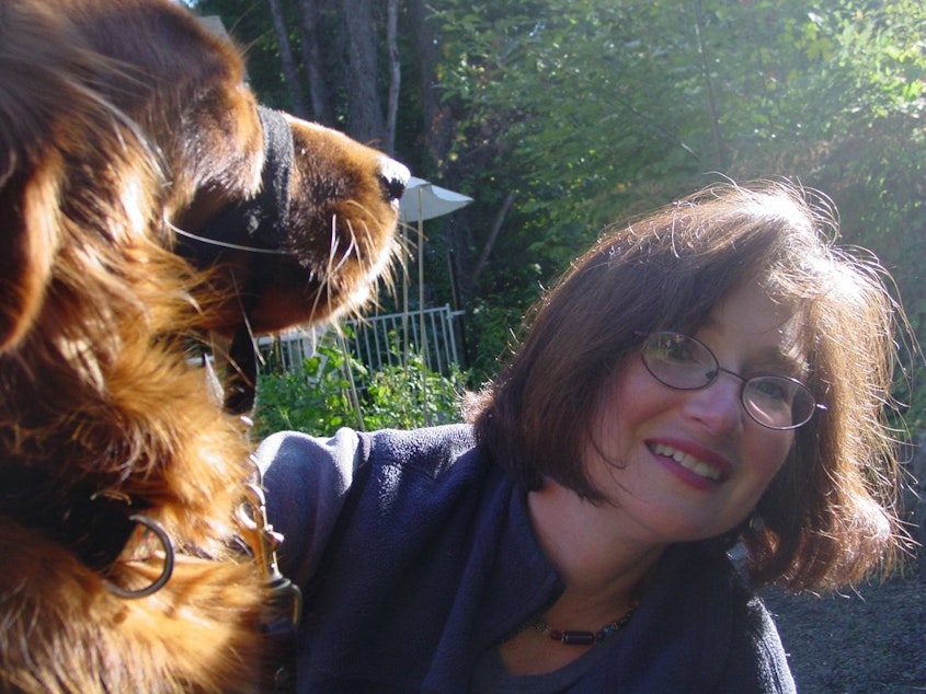 caption: Lucia Perillo with her service dog, Dawby.