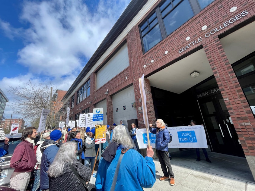caption: A group of Seattle Colleges staff protests on April 11 outside the community college district's headquarters in Capitol Hill. They called on their employers to provide equitable wages and more resources to students.