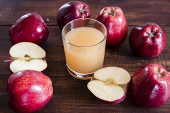 caption: Traces of cadmium, lead and arsenic have been discovered in many brands of apple and other fruit juices.CREDIT: Westend61/Getty Images