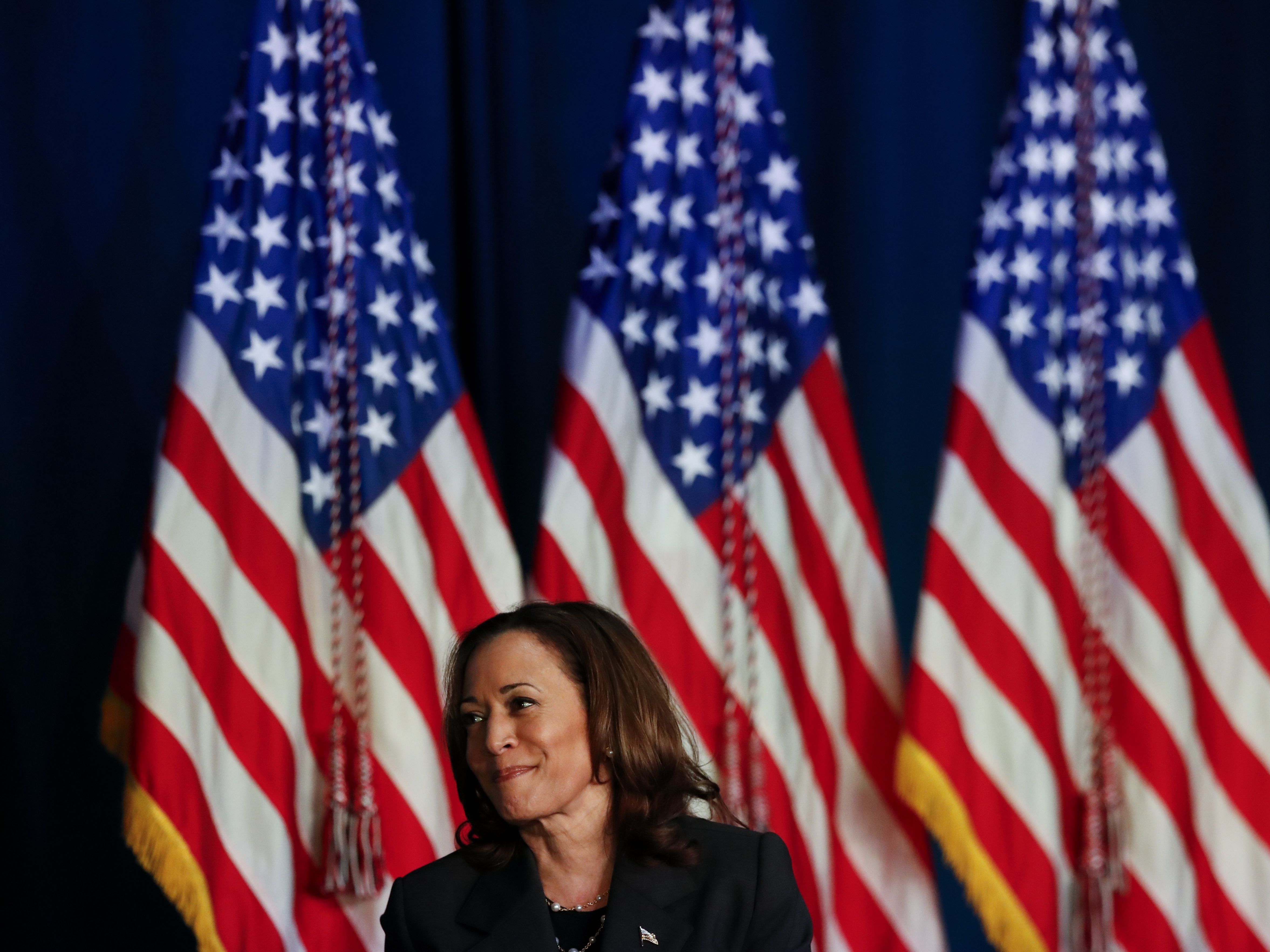 caption: Vice President Harris attends an event on Wednesday in Kalamazoo, Mich.  