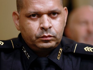 caption: U.S. Capitol Police Sgt. Aquilino Gonell testified last July before the U.S. House Select Committee investigating the Jan. 6 attack on the U.S. Capitol. Authorities say some 140 police officers were injured during the insurrection.