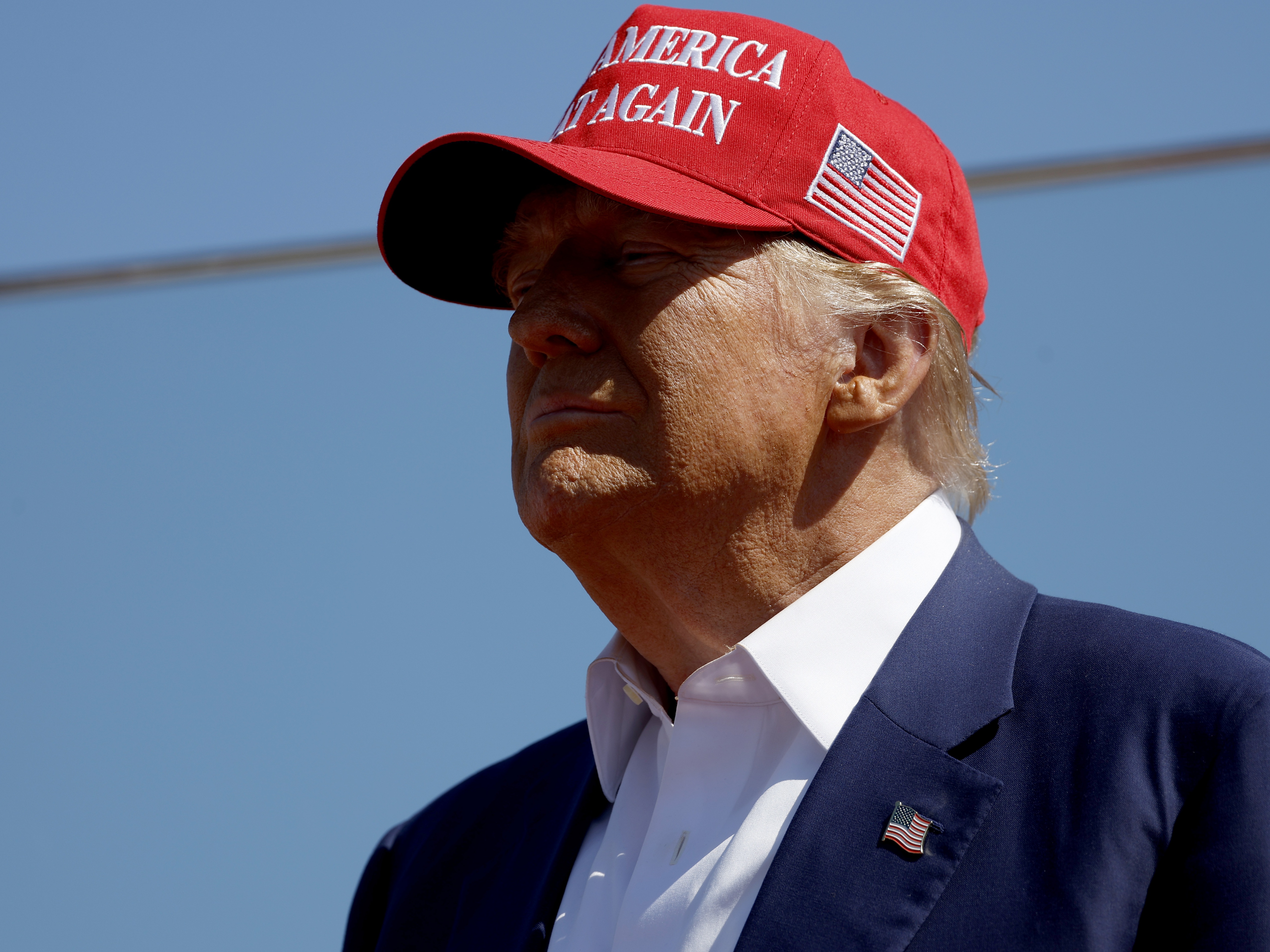 caption: Former President Donald Trump speaks at a rally at the Aero Center Wilmington in Wilmington, N.C., on Saturday.