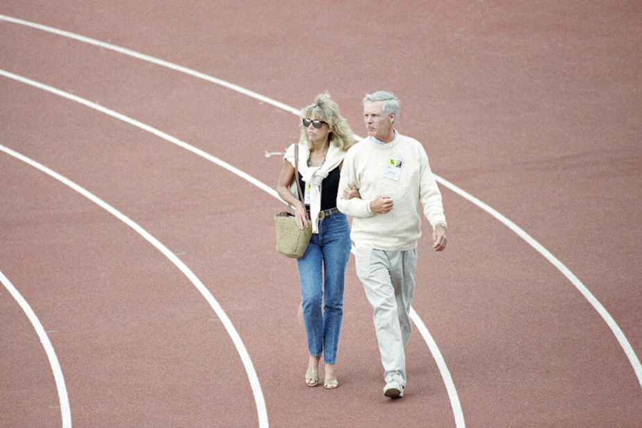 caption: Ted Turner and actress Jane Fonda walk along the track at the Goodwill Games on Monday, July 24, 1990 in Seattle. Turner could lose as much as $26 million on the games doubling earlier projections from the Turner Broadcasting System. 
