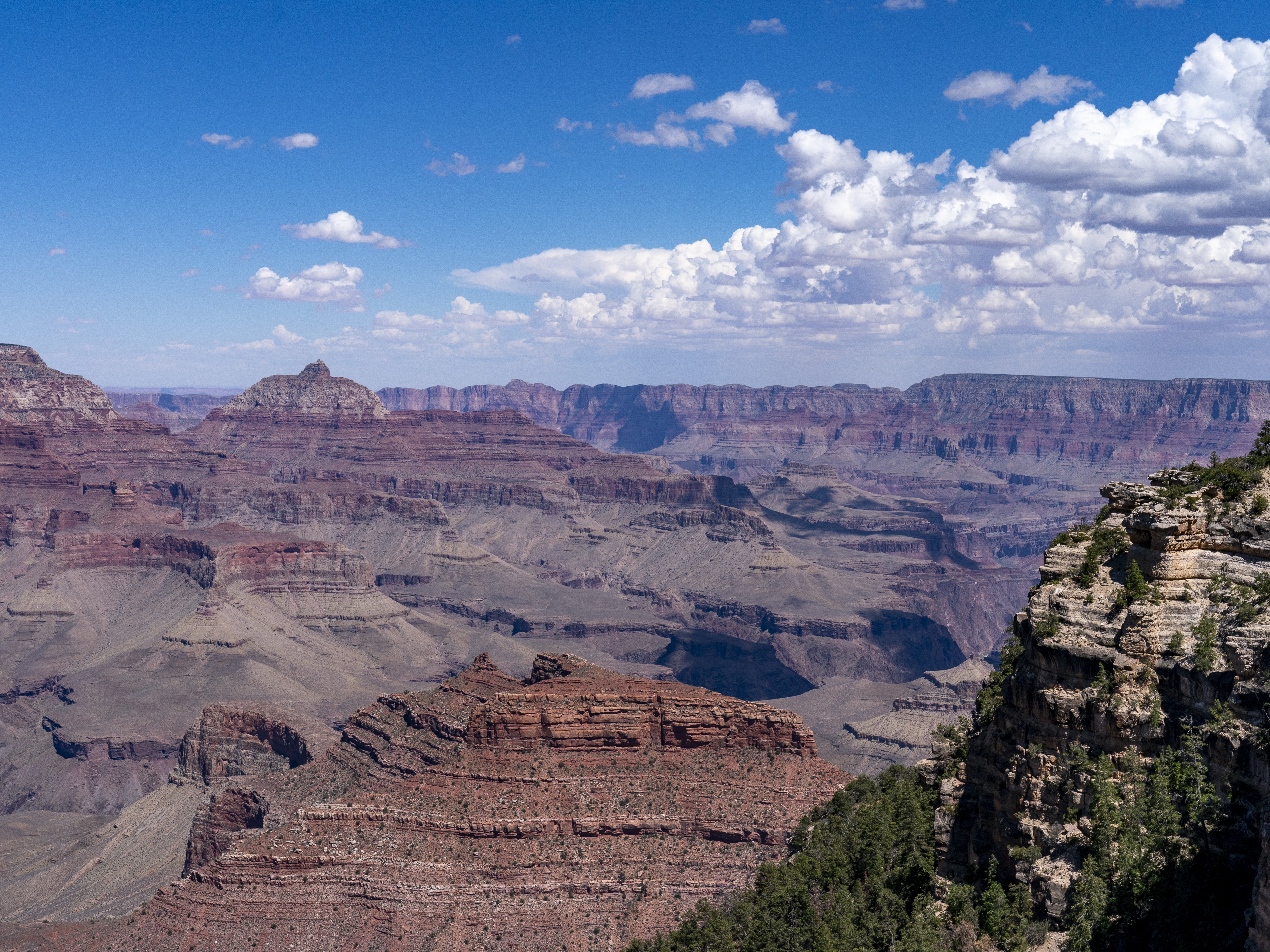 caption: Clouds pass over the South Rim of Grand Canyon National Park in Grand Canyon Village, Ariz., Tuesday, Aug. 8, 2023. 