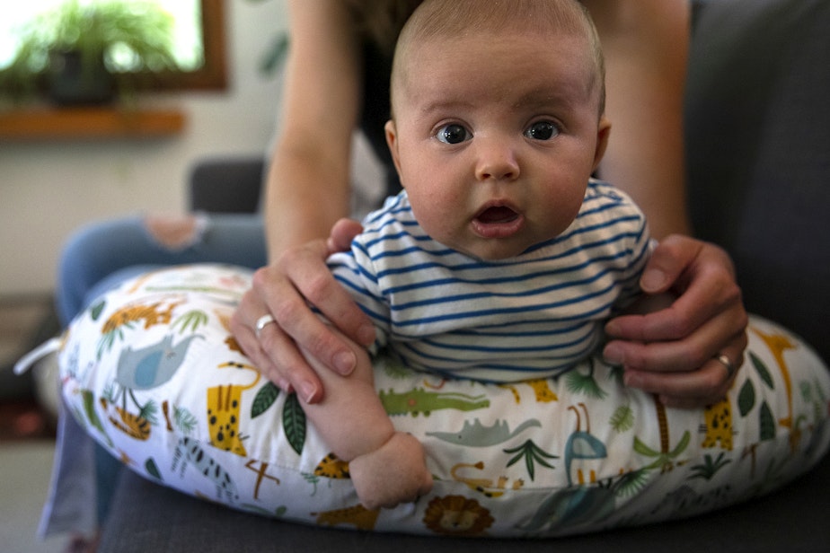 caption: Two-month-old Arlo Vella during tummy time on Tuesday, July 16, 2024, at his home on Bainbridge Island.