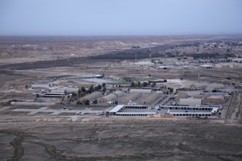 caption: This aerial photo shows Ain al-Assad air base in the western Anbar desert, Iraq, in December 2019.
