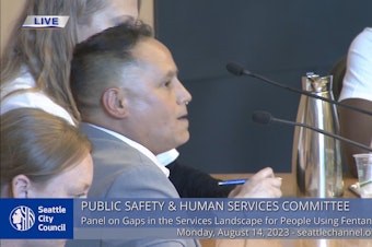 caption: Johnny Bousquet asked the Seattle City Council to fund diversion programs as it considers a new drug ordinance. “Instead of going to jail I was given the opportunity to get my life back on track,” he said. He now supervises caseworkers in the program that helped him enter recovery. 