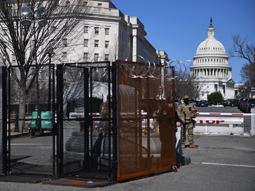 caption: Members of the National Guard patrol near the U.S. Capitol Building in Washington in March.