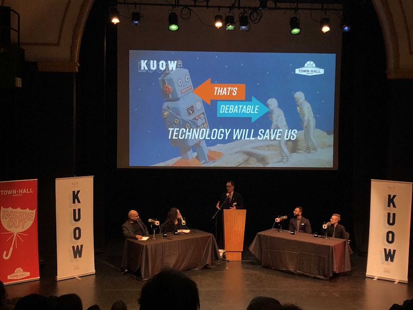 caption: Hanson Hosein, Amy Webb, Vinay Narayan and Elizabeth Scallon participate in KUOW's That's Debatable event on March 24, 2019.