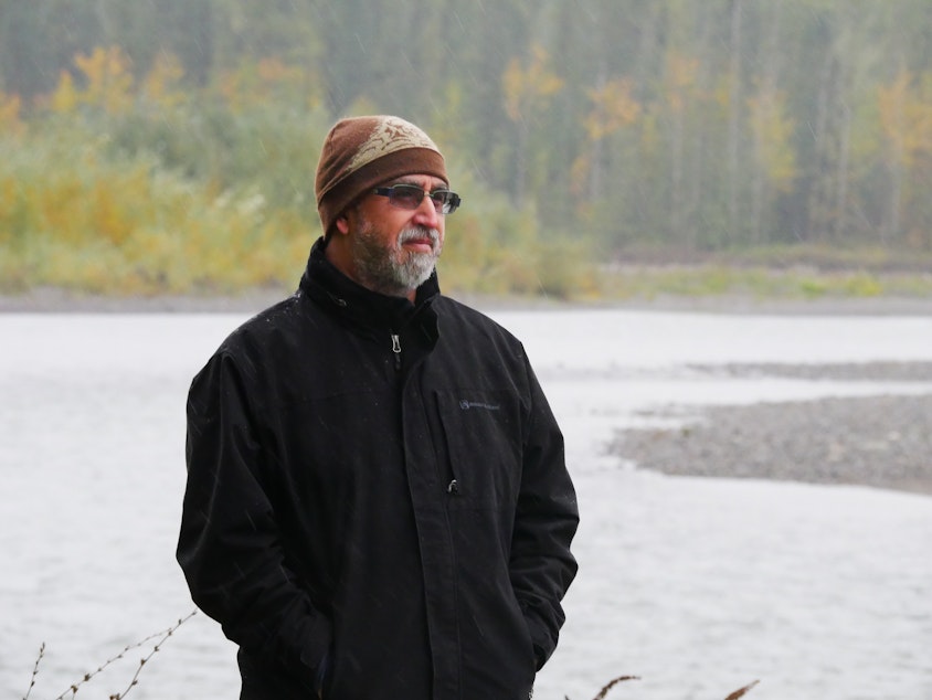 caption: Nooksack Tribe planning manager Ross Cline Jr. in front of the Nooksack River
