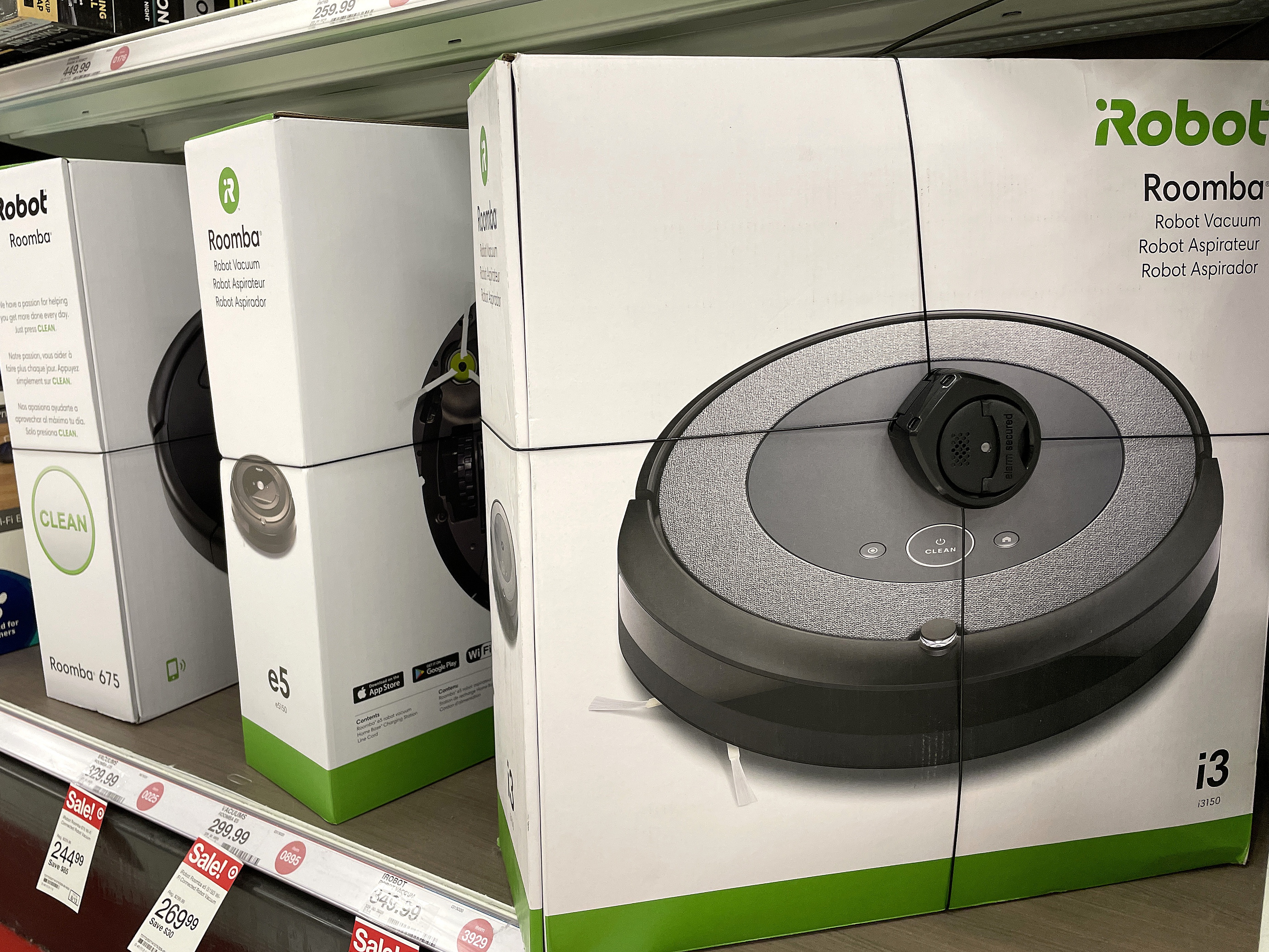 caption: Roomba robot vacuums made by iRobot are displayed on a shelf at a Target store in California.