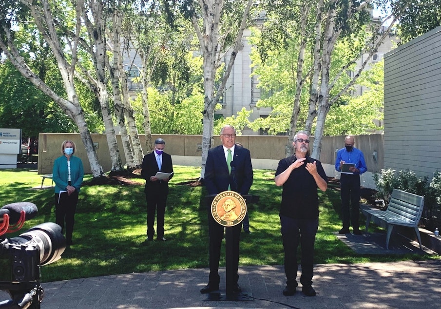 caption: In August, Gov. Jay Inslee announced that state employees and health care and long-term care workers would have to be fully vaccinated by October 18, or face termination. 