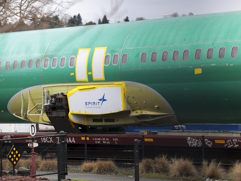 caption: The Spirit AeroSystems logo is pictured on an unpainted 737 fuselage as Boeing's 737 factory teams hold the first day of a "Quality Stand Down" for the 737 program at Boeing's factory in Renton, Washington on Jan. 25.
