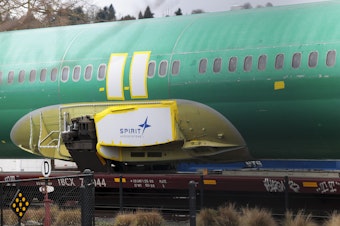 caption: The Spirit AeroSystems logo is pictured on an unpainted 737 fuselage as Boeing's 737 factory teams hold the first day of a "Quality Stand Down" for the 737 program at Boeing's factory in Renton, Washington on Jan. 25.