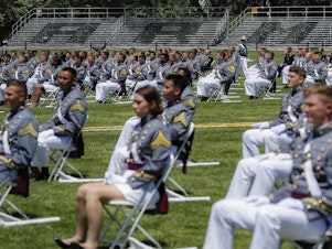 caption: Stands remain empty as family members of United States Military Academy graduating cadets are restricted from attending commencement ceremonies on June 13 in West Point, N.Y