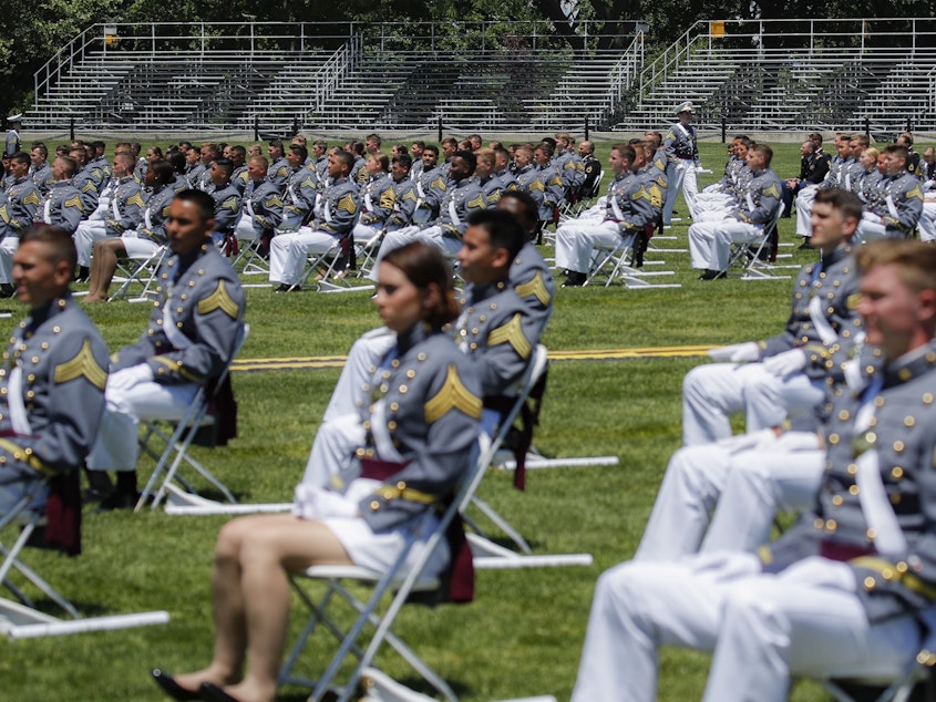 caption: Stands remain empty as family members of United States Military Academy graduating cadets are restricted from attending commencement ceremonies on June 13 in West Point, N.Y