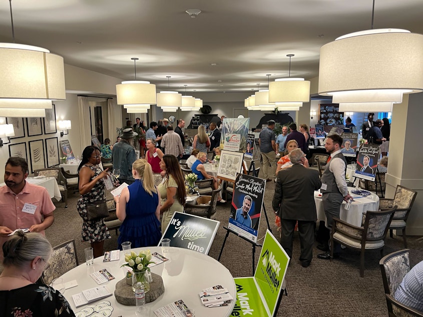 caption: Voters talk to Washington governor candidates at a meet-and-greet in Renton on July 9, 2024.