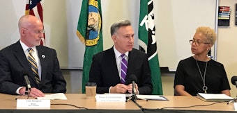 caption: Seattle Mayor Tim Burgess, King County Executive Dow Constantine and Deputy Executive Rhonda Berry at a press conference announcing the intent to move youth detention oversight to Public Health Seattle King County.