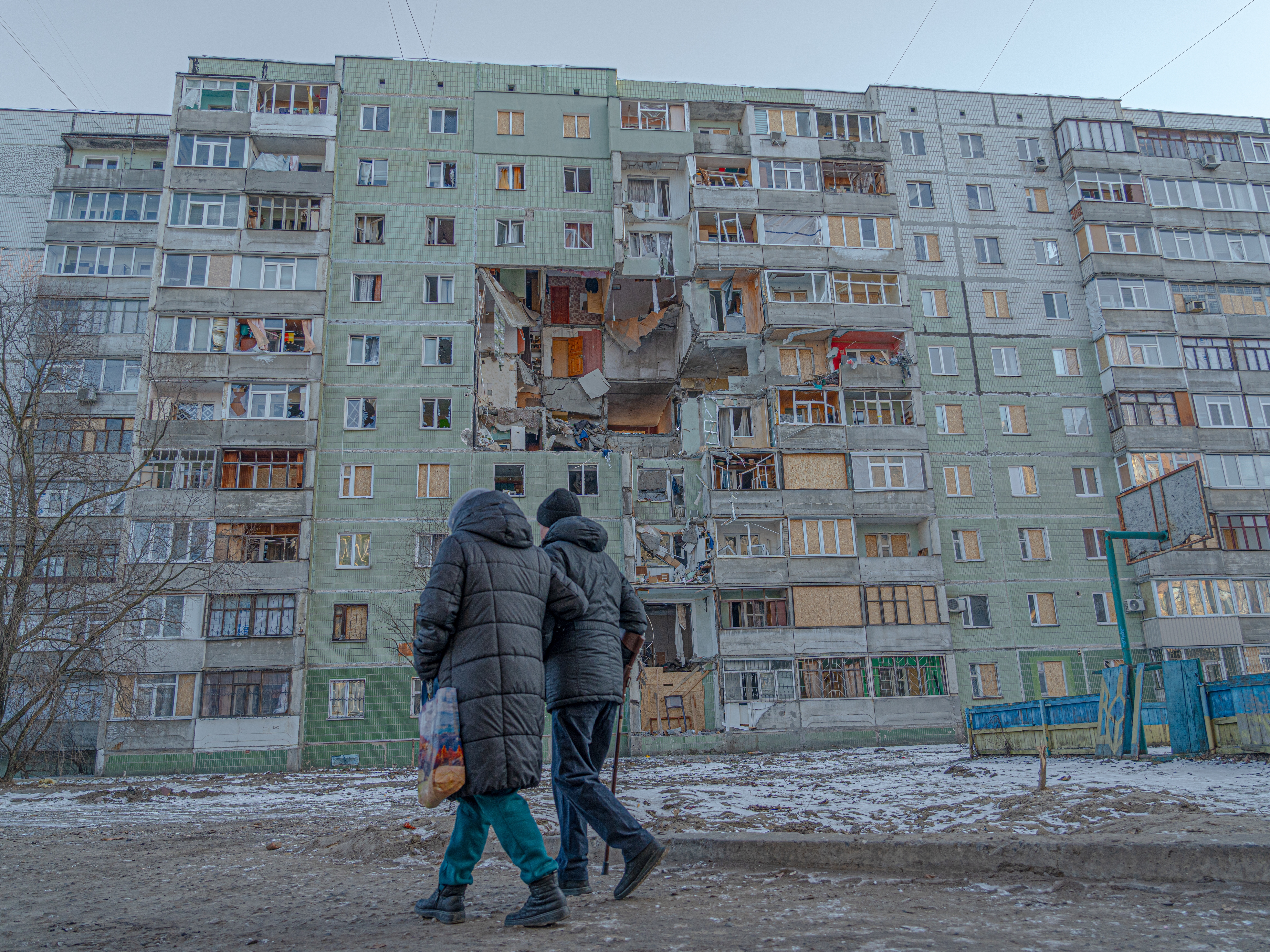 caption: An apartment building in the city of Sumy after Russia struck it with a Shahed drone early this year. "We need more air defense, we need more everything," said Anton Svachko, a member of Ukraine's parliament from the city.