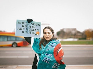 caption: Bernadette Demientieff of the Gwich'in Steering Committee participates in a December 2017 event in Washington, D.C., where advocates pushed Congress to protect the Arctic National Wildlife Refuge from oil development.