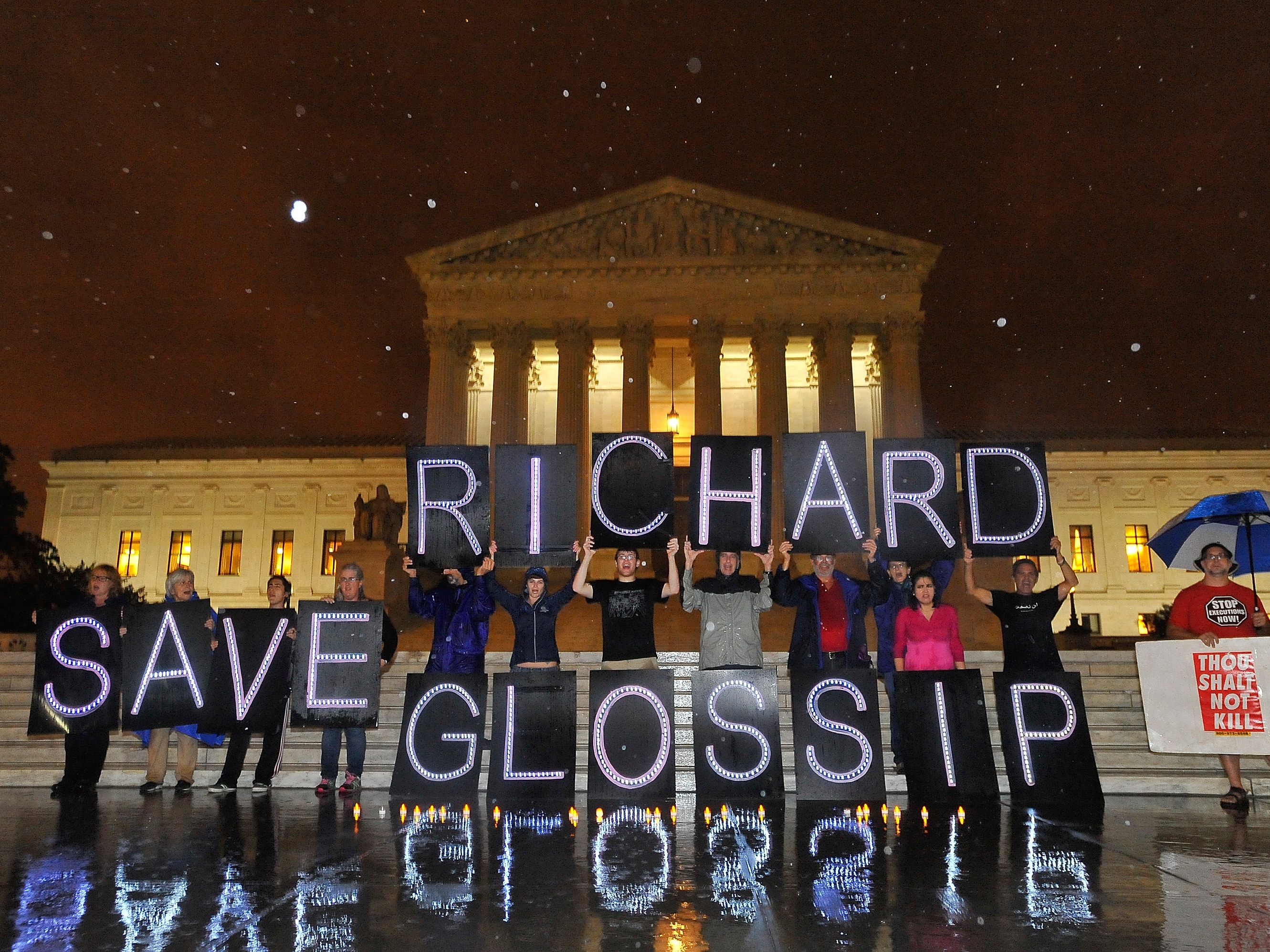 caption: Anti-death penalty activists rally outside the U.S. Supreme Court on Sept. 29 in an attempt to prevent the execution of Oklahoma inmate Richard Glossip.