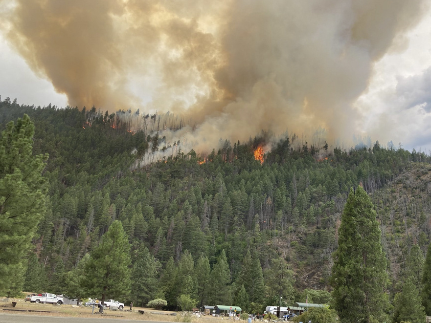 caption: Smoke rises from the Head Fire in Klamath National Forest, Calif., on Tuesday Aug. 15, 2023.
