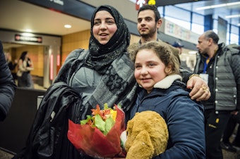 caption: Jaidaa Bazara, left, with her younger siblings Alaa and Mohamed Bazara.