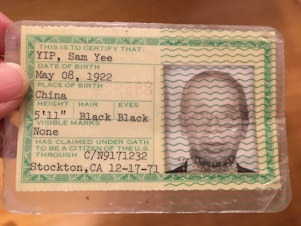 caption: The author's maternal grandfather's green card. His birthday is listed as two years before he was actually born. 