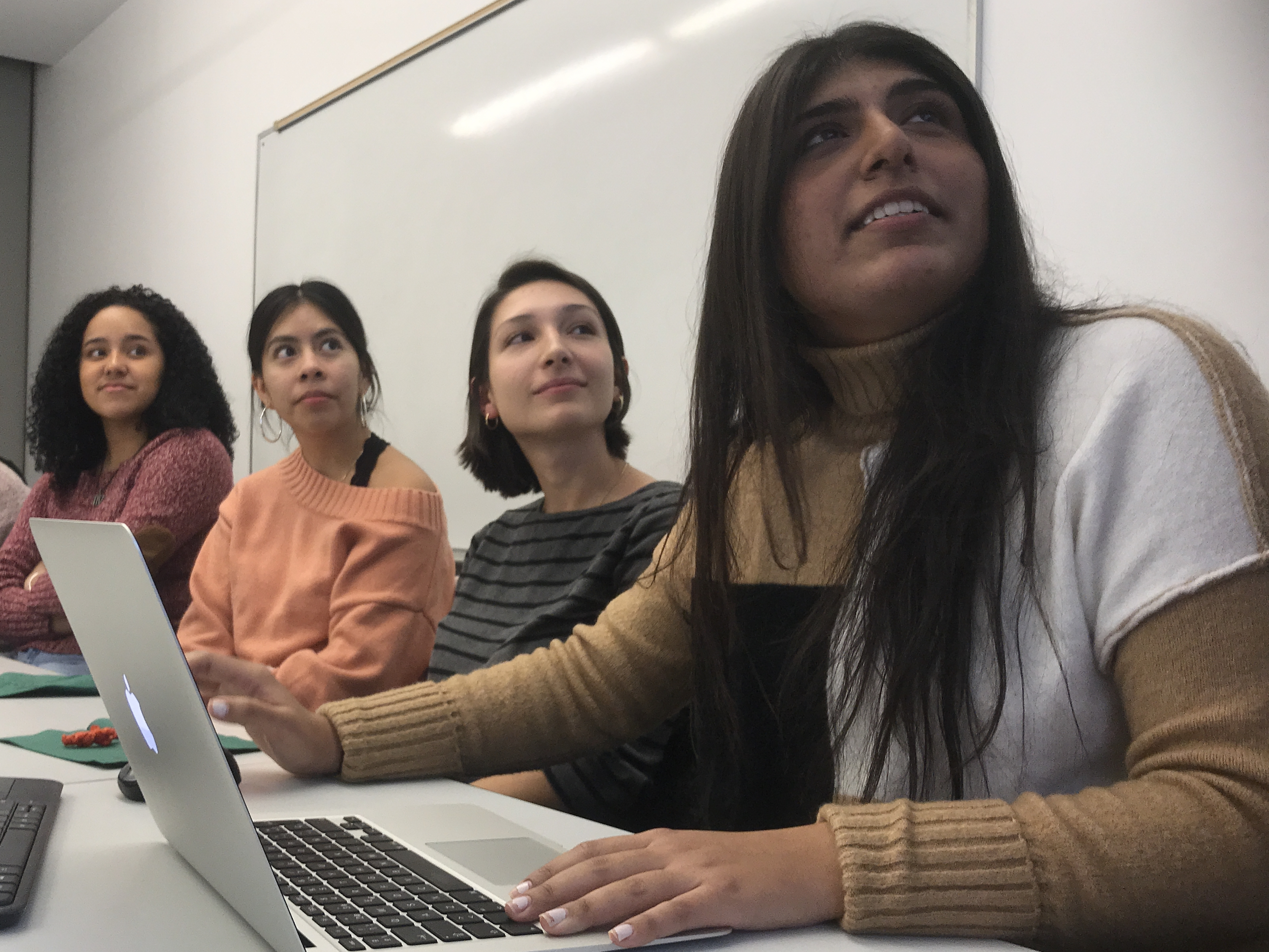 caption: (From left) Daniela Lebron, 18; Jennifer Lopez, 17; Klea Kalia, 21; and Yasmin Butt, 21, attend an event at Barnard College in New York City for Latino, first-generation and low-income students interested in studying abroad.