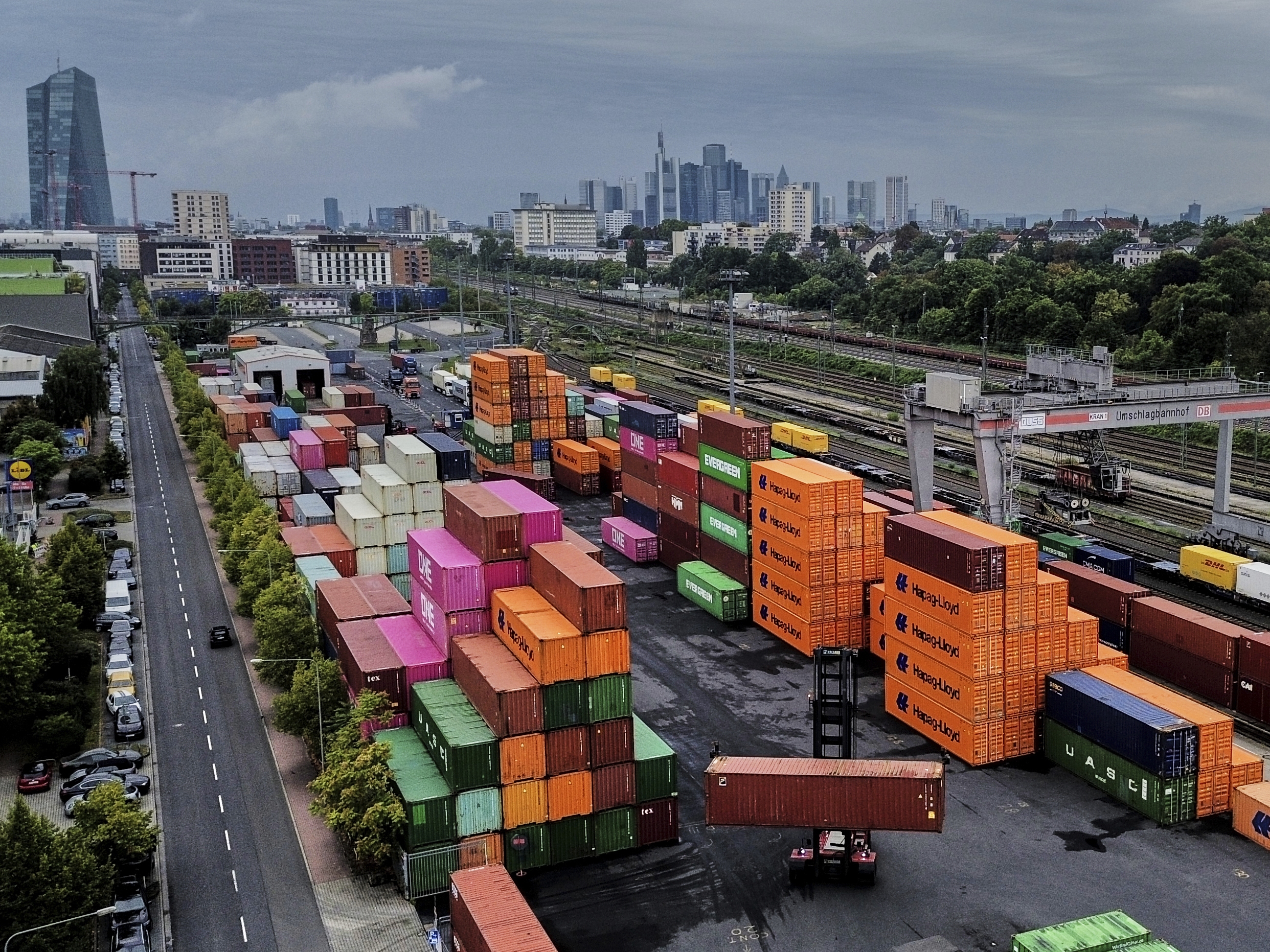 caption: Containers are piled upon a cargo terminal in Frankfurt, Germany, on Sept. 9, 2025.